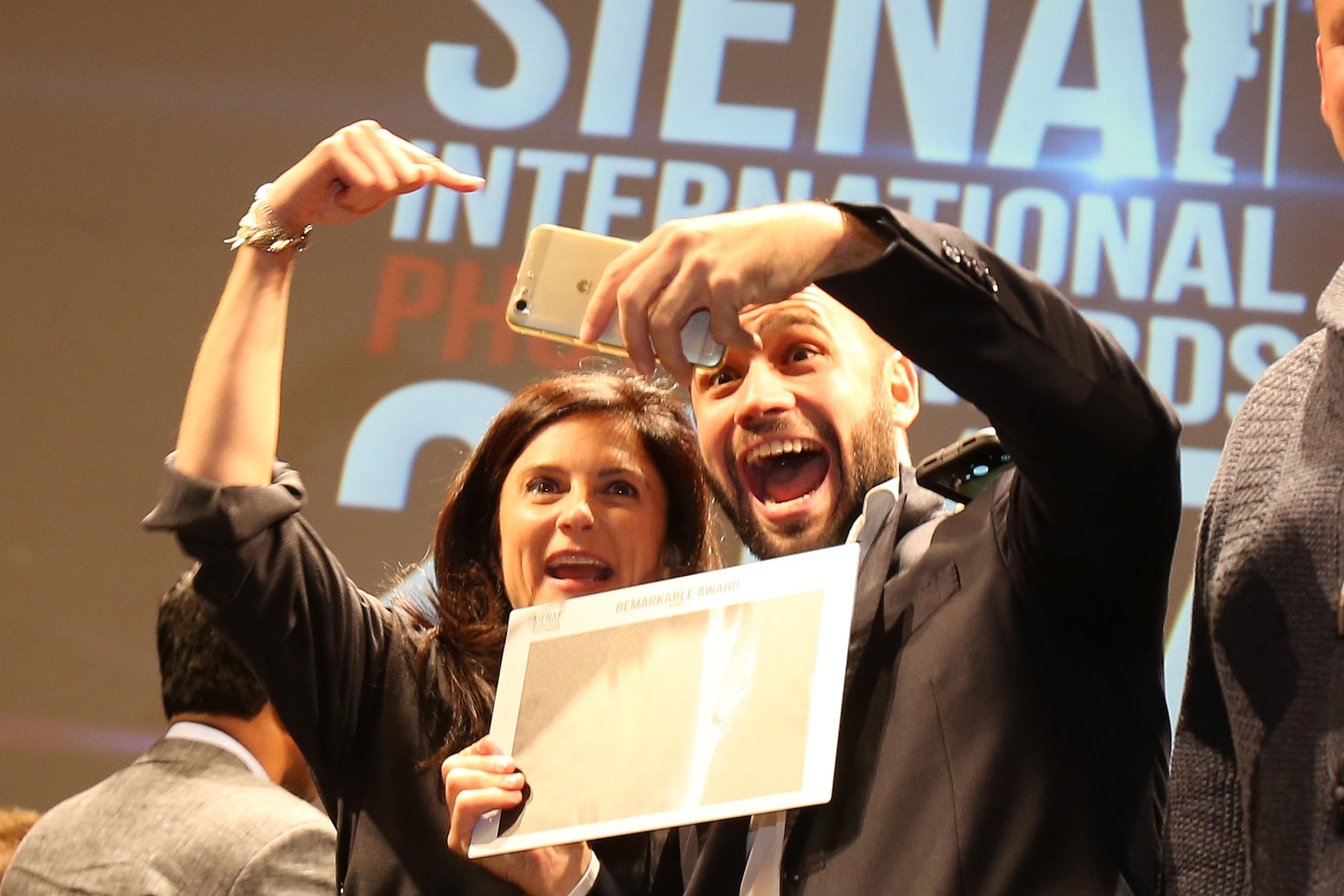 Ami Vitale and Andrea Rizzi during the Awards Ceremony at the Teatro dei Rozzi